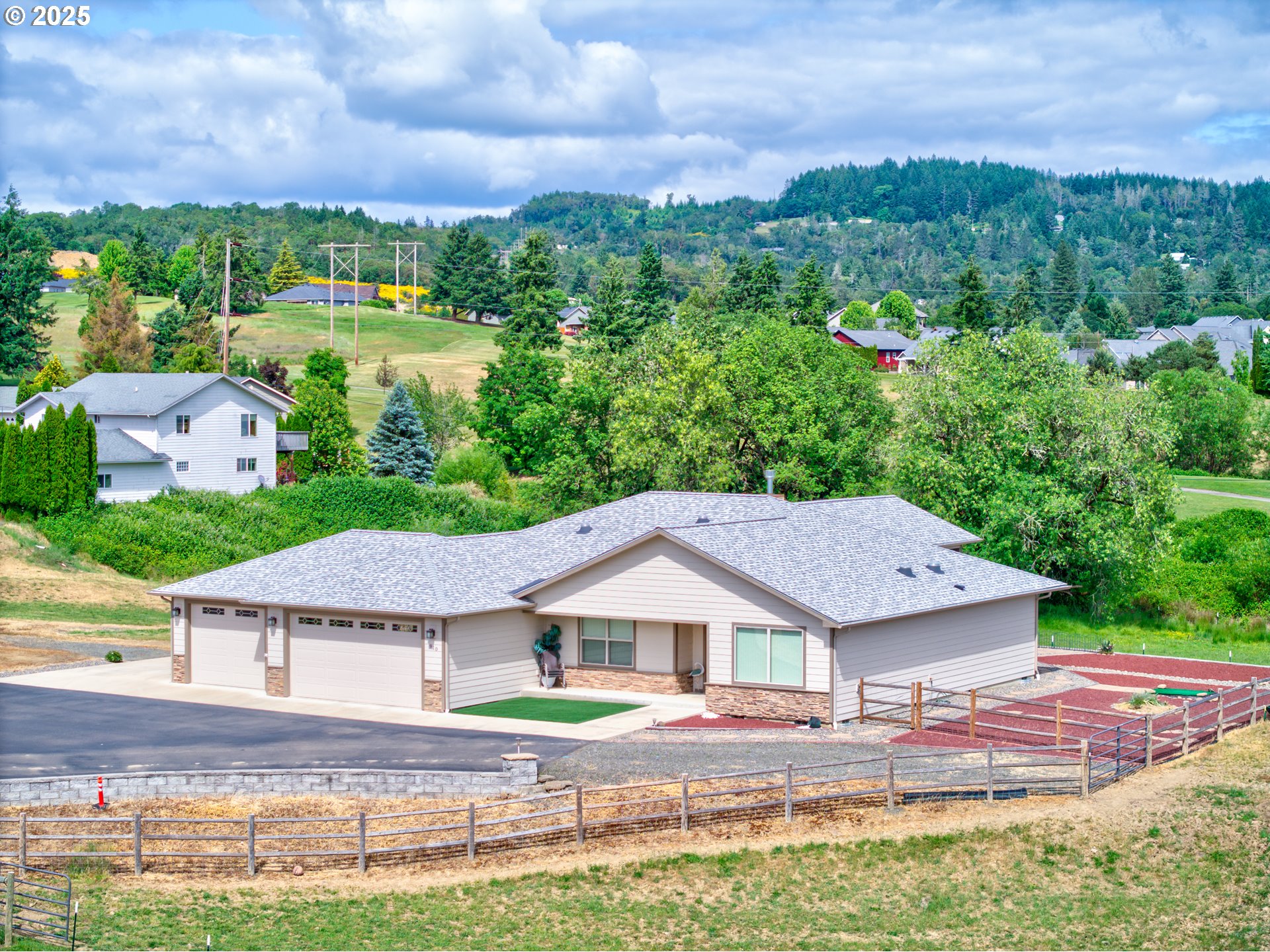 910 Swallow Avenue Sutherlin, OR 97479 - Photo 36 of 44 a aerial view of a house with a big yard and large tree