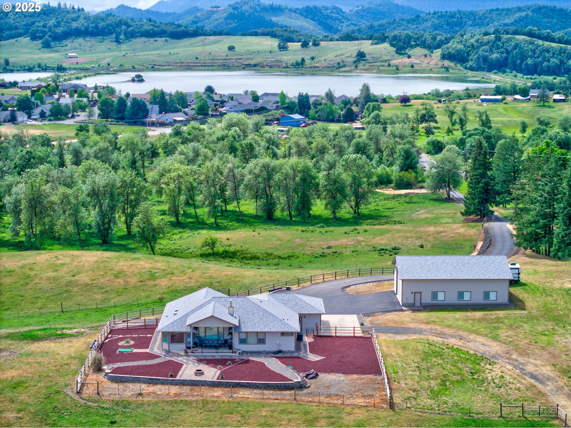 910 Swallow Avenue Sutherlin, OR 97479 - Photo 40 of 44 an aerial view of a house with outdoor space and city view