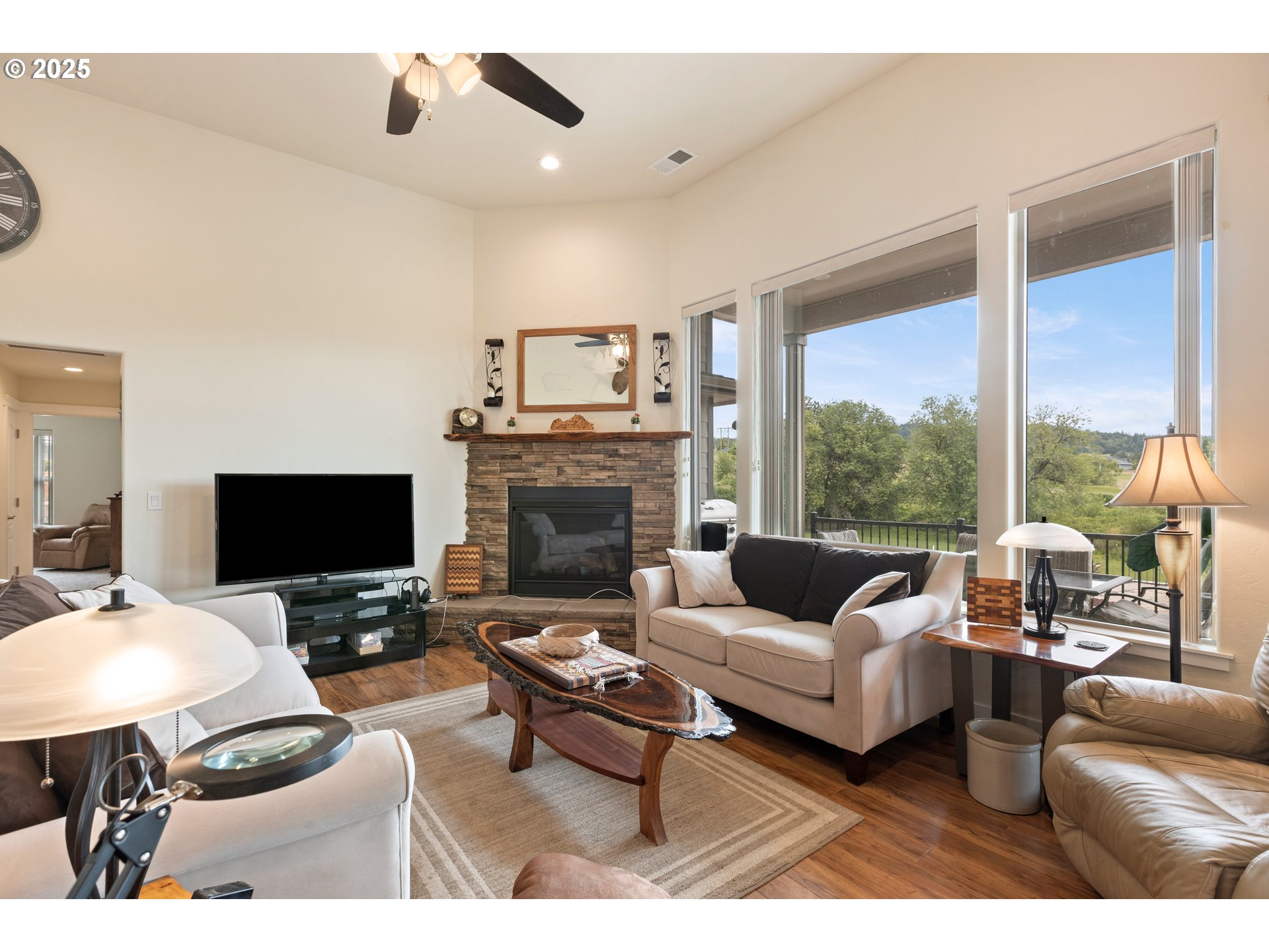 910 Swallow Avenue Sutherlin, OR 97479 - Photo 4 of 44 a living room with furniture a fireplace and a flat screen tv