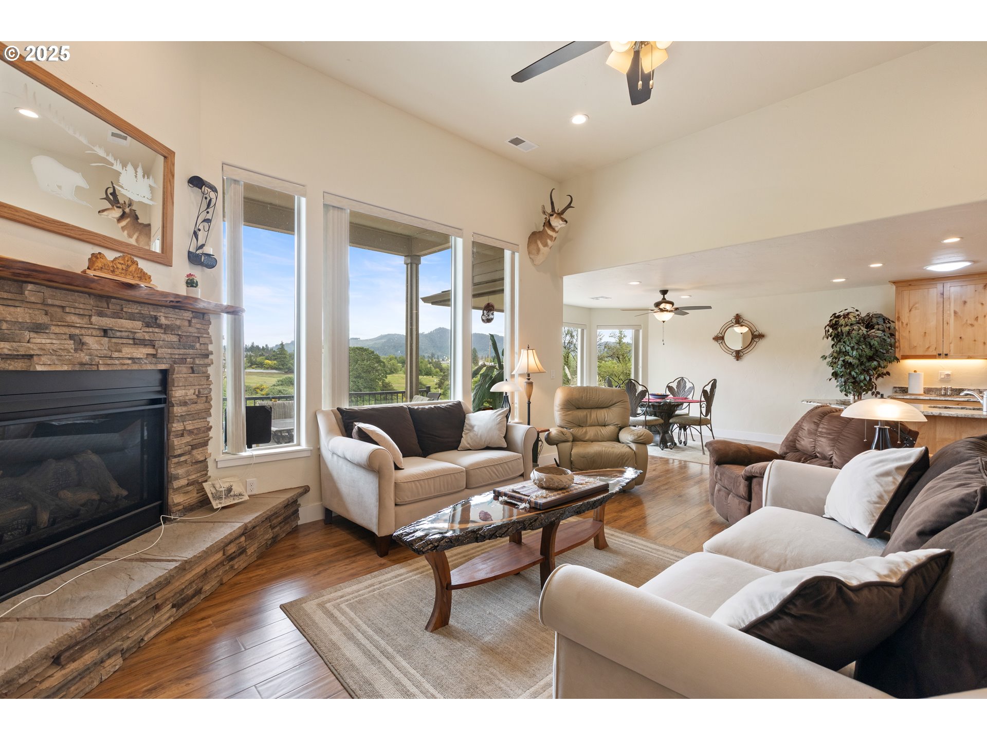 910 Swallow Avenue Sutherlin, OR 97479 - Photo 7 of 44 a living room with furniture and a fireplace