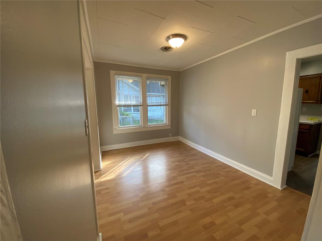 5441 18th Street Zephyrhills, FL 33542 - Photo 16 of 50 an empty room with wooden floor and windows