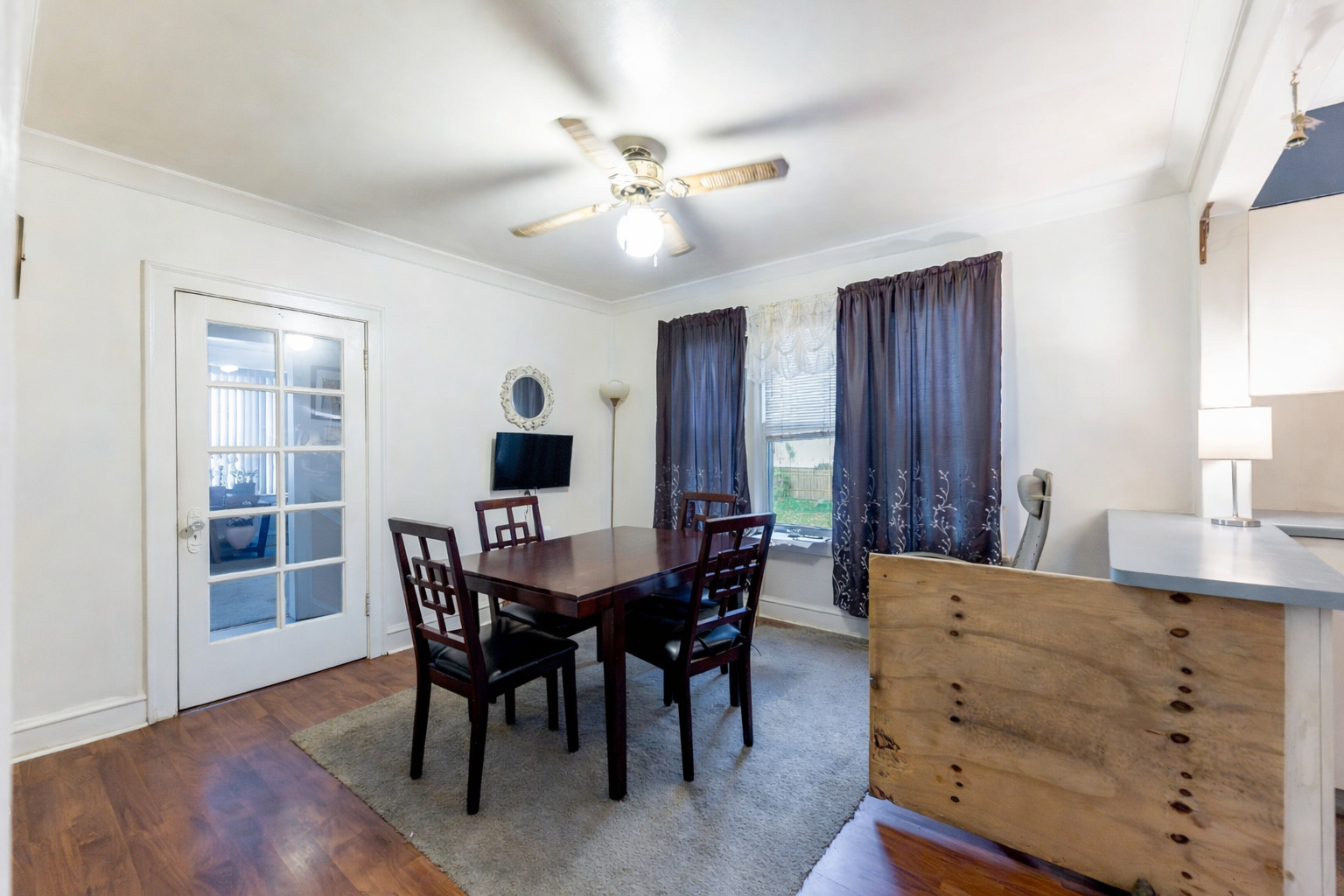 8129 South Cornell Avenue Chicago, IL 60617 - Photo 6 of 18 a view of a dining room with furniture and wooden floor