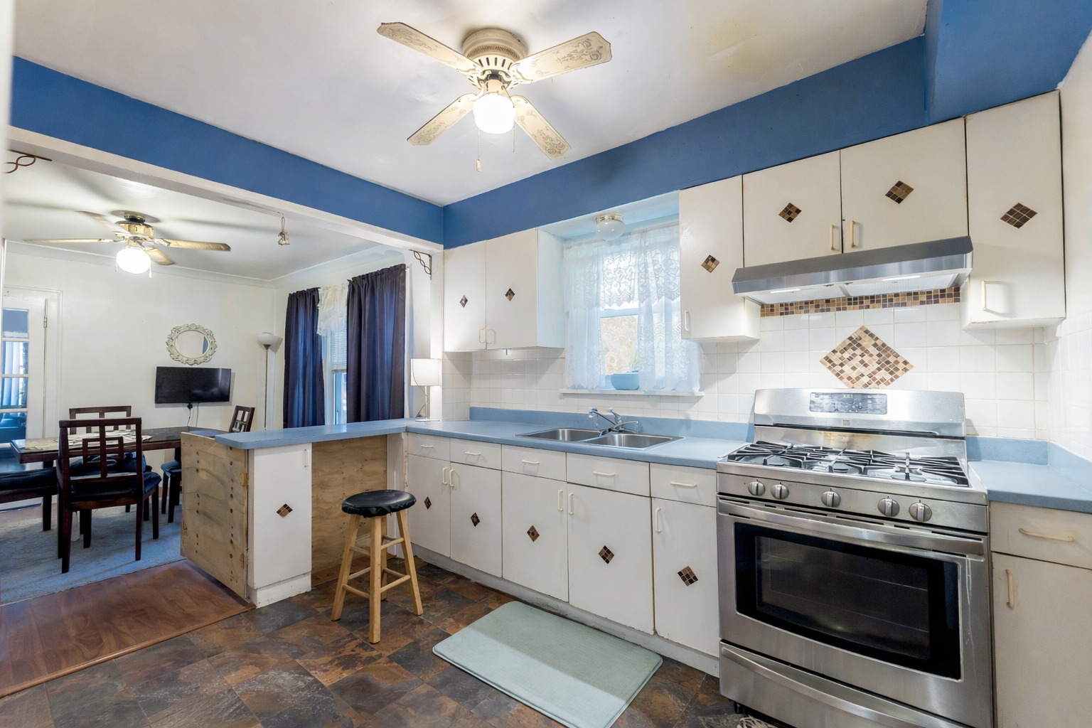 8129 South Cornell Avenue Chicago, IL 60617 - Photo 8 of 18 a kitchen with stainless steel appliances a stove a sink and cabinets