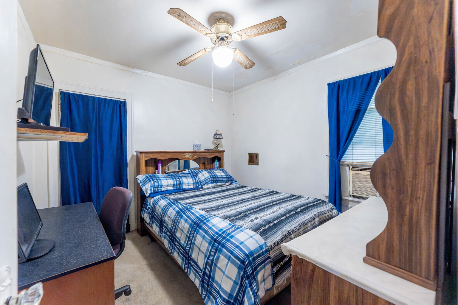 8129 South Cornell Avenue Chicago, IL 60617 - Photo 9 of 18 a bedroom with a bed and a chandelier