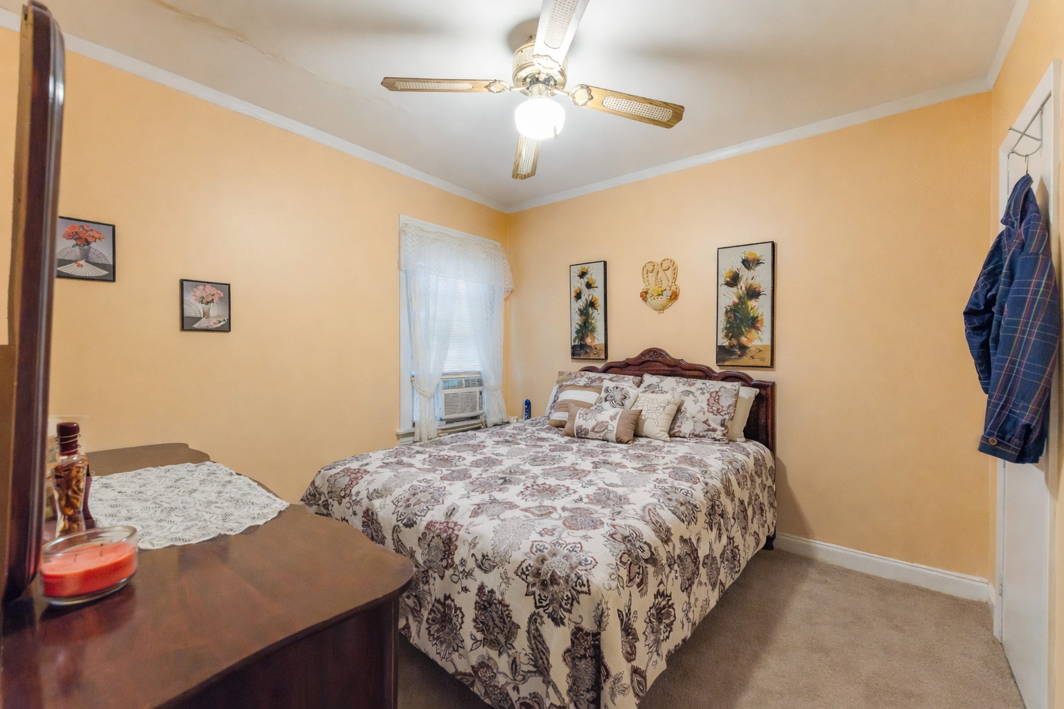 8129 South Cornell Avenue Chicago, IL 60617 - Photo 10 of 18 a bedroom with a bed and a table in it