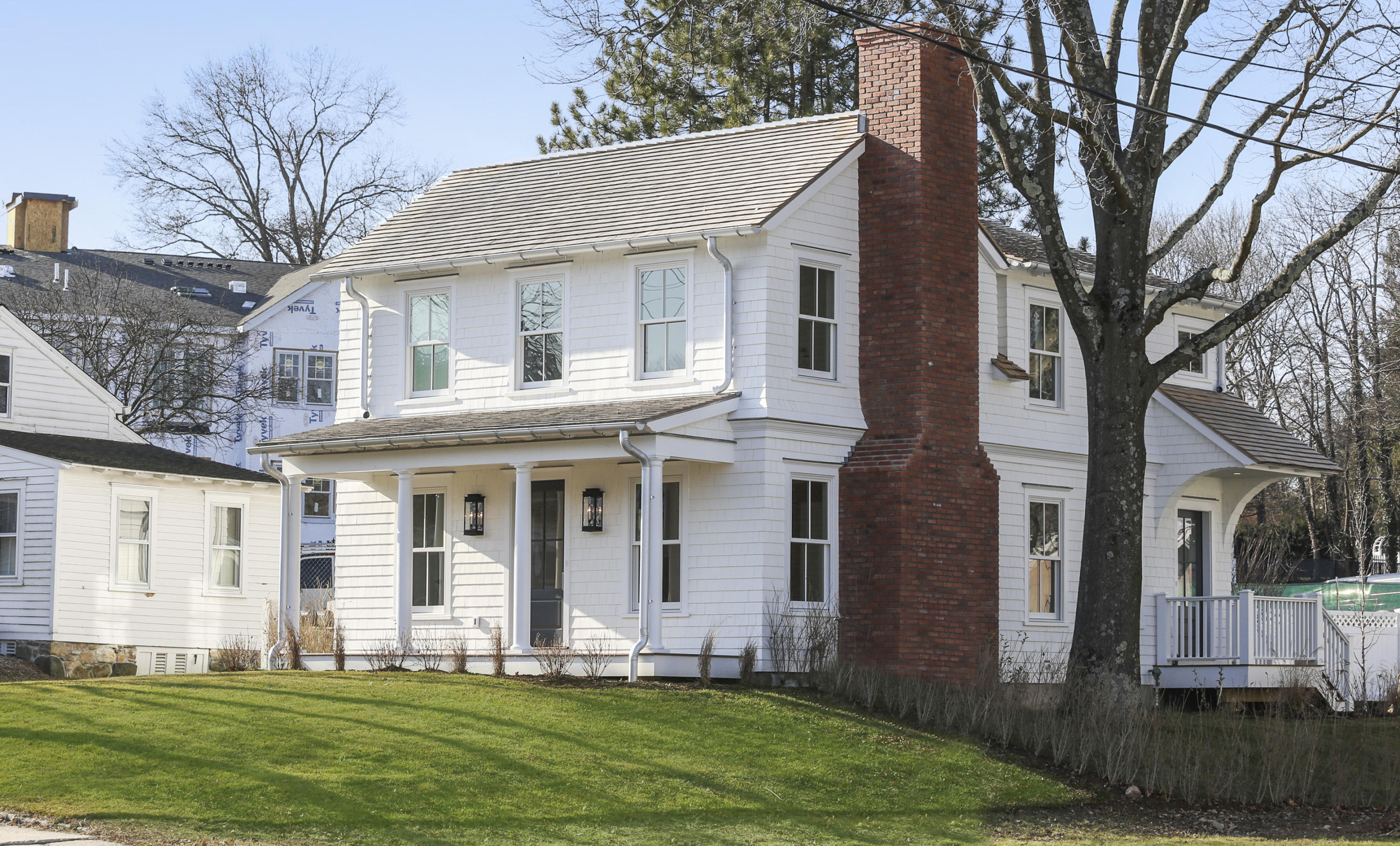 693 Post Road Darien, CT 06820 - Photo 2 of 41 a front view of a house with a yard