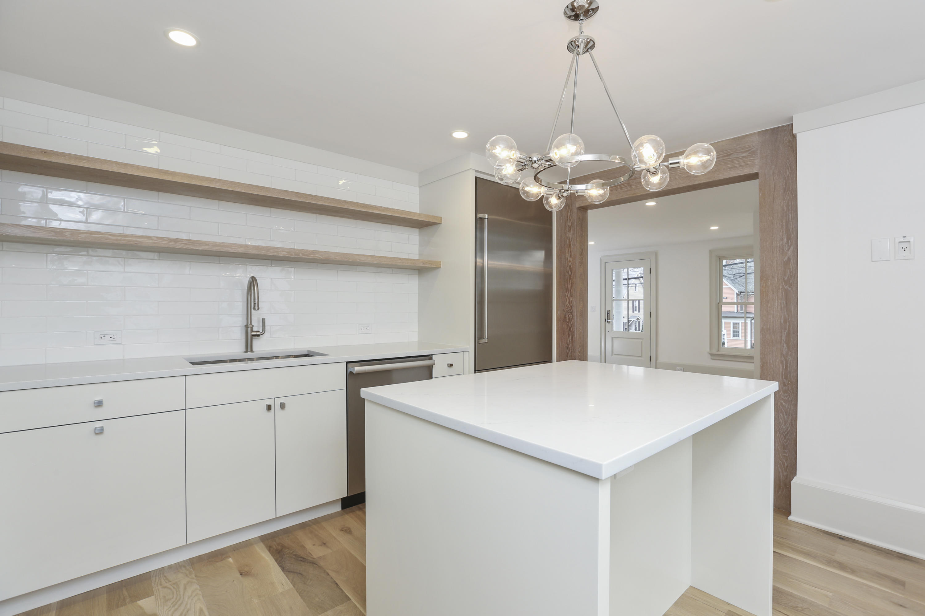 693 Post Road Darien, CT 06820 - Photo 11 of 41 a view of a kitchen sink and chandelier