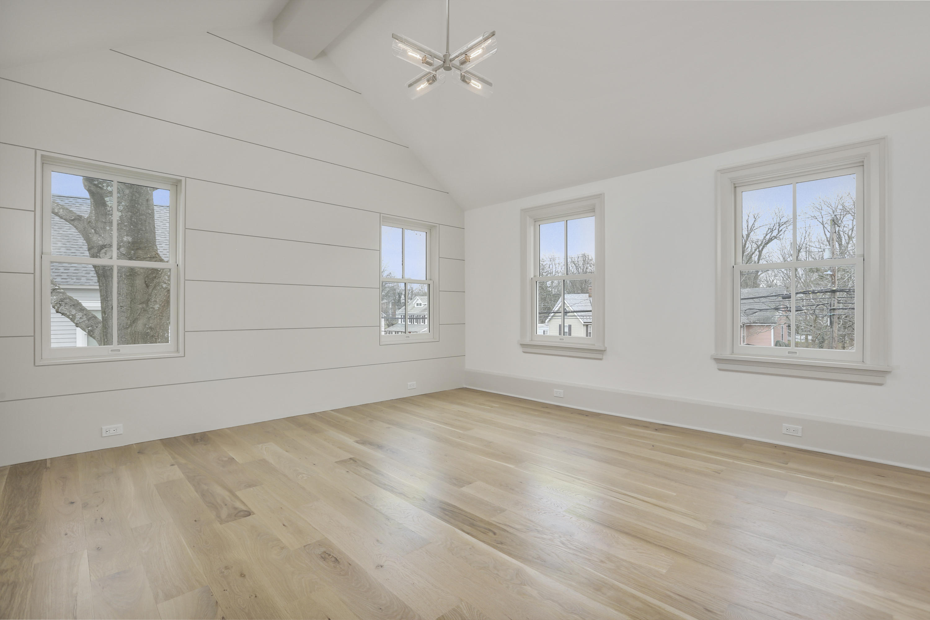 693 Post Road Darien, CT 06820 - Photo 13 of 41 a view of an empty room with a window and wooden floor
