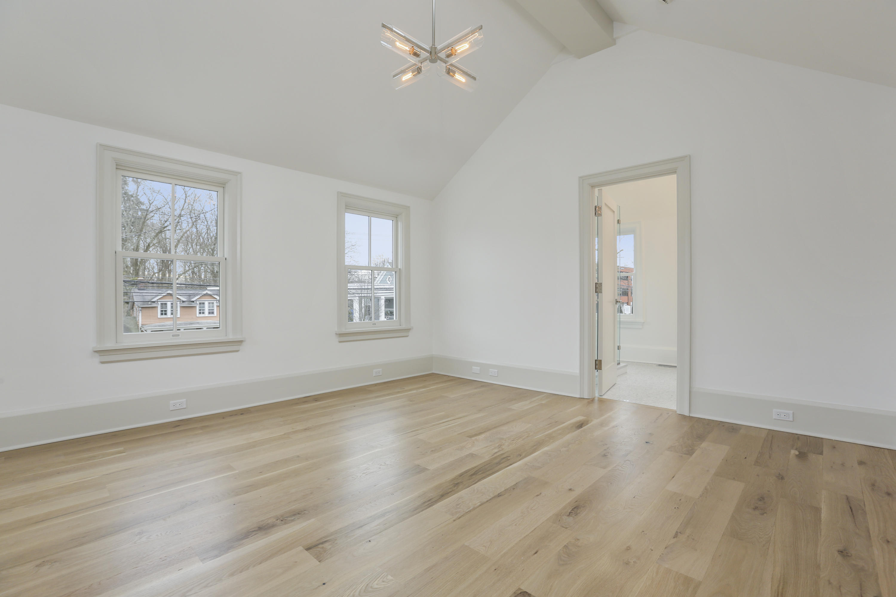 693 Post Road Darien, CT 06820 - Photo 14 of 41 a view of an empty room with wooden floor and a window