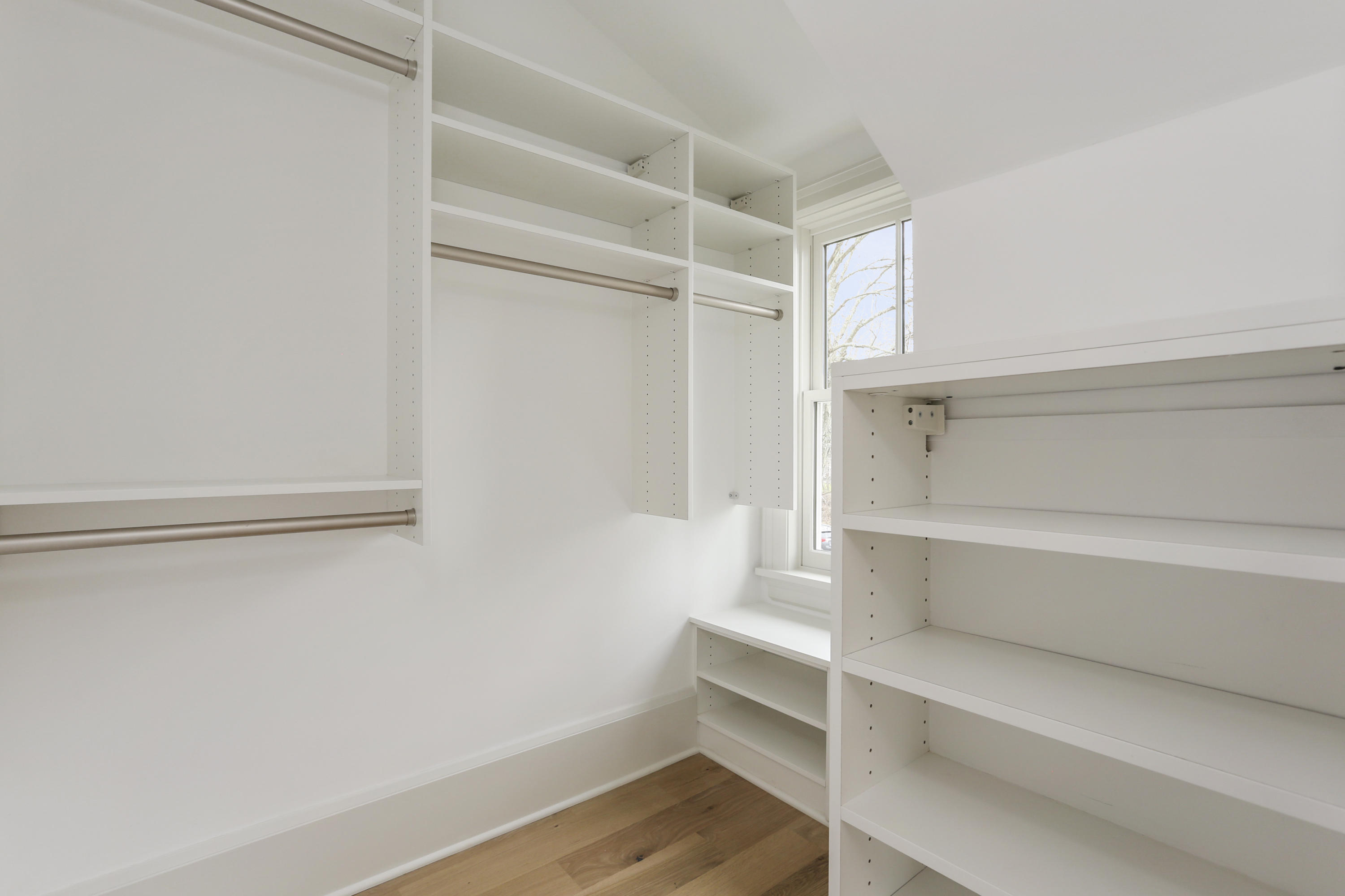 693 Post Road Darien, CT 06820 - Photo 17 of 41 a view of walk in closet with empty racks