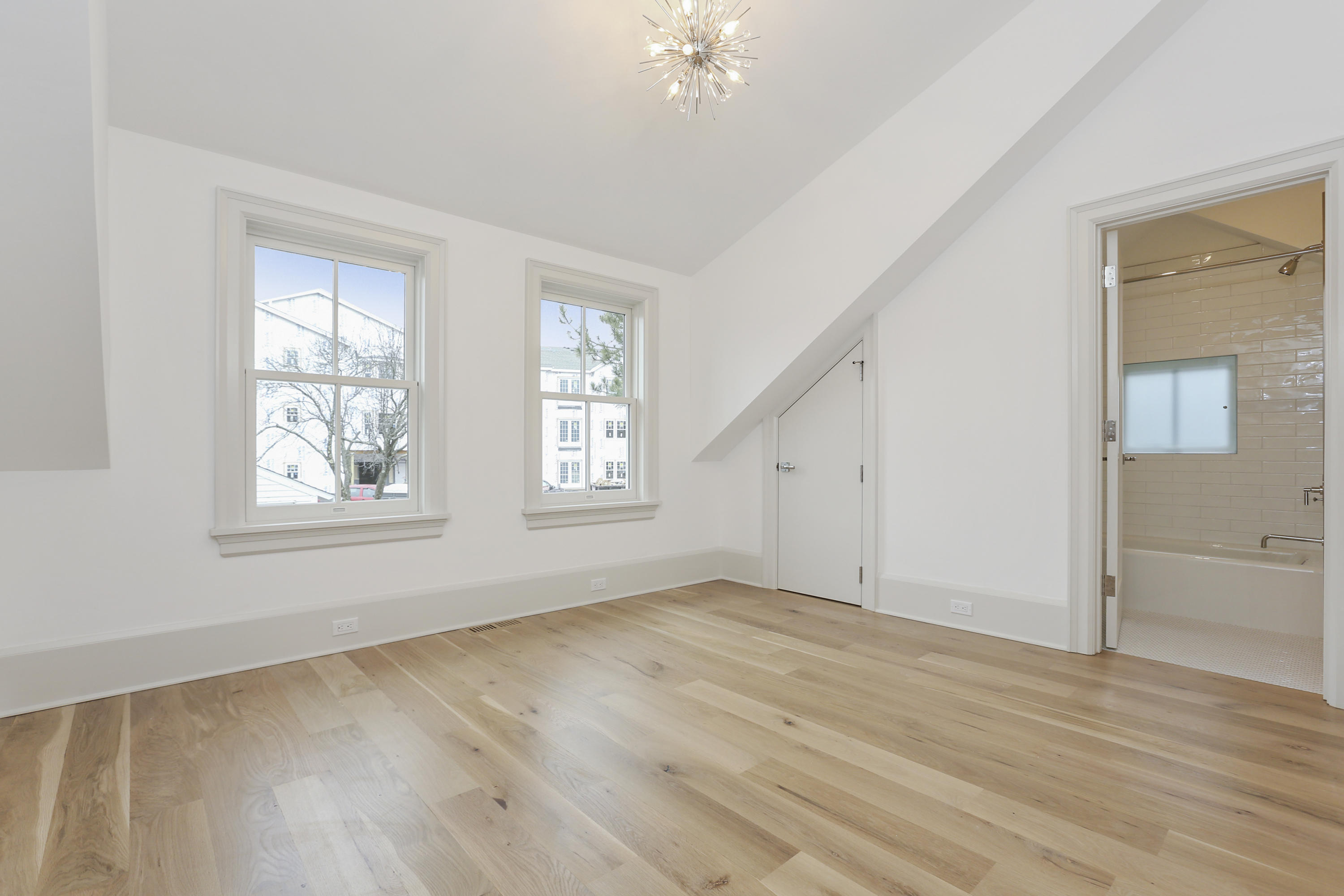 693 Post Road Darien, CT 06820 - Photo 18 of 41 a view of an empty room with wooden floor and a window