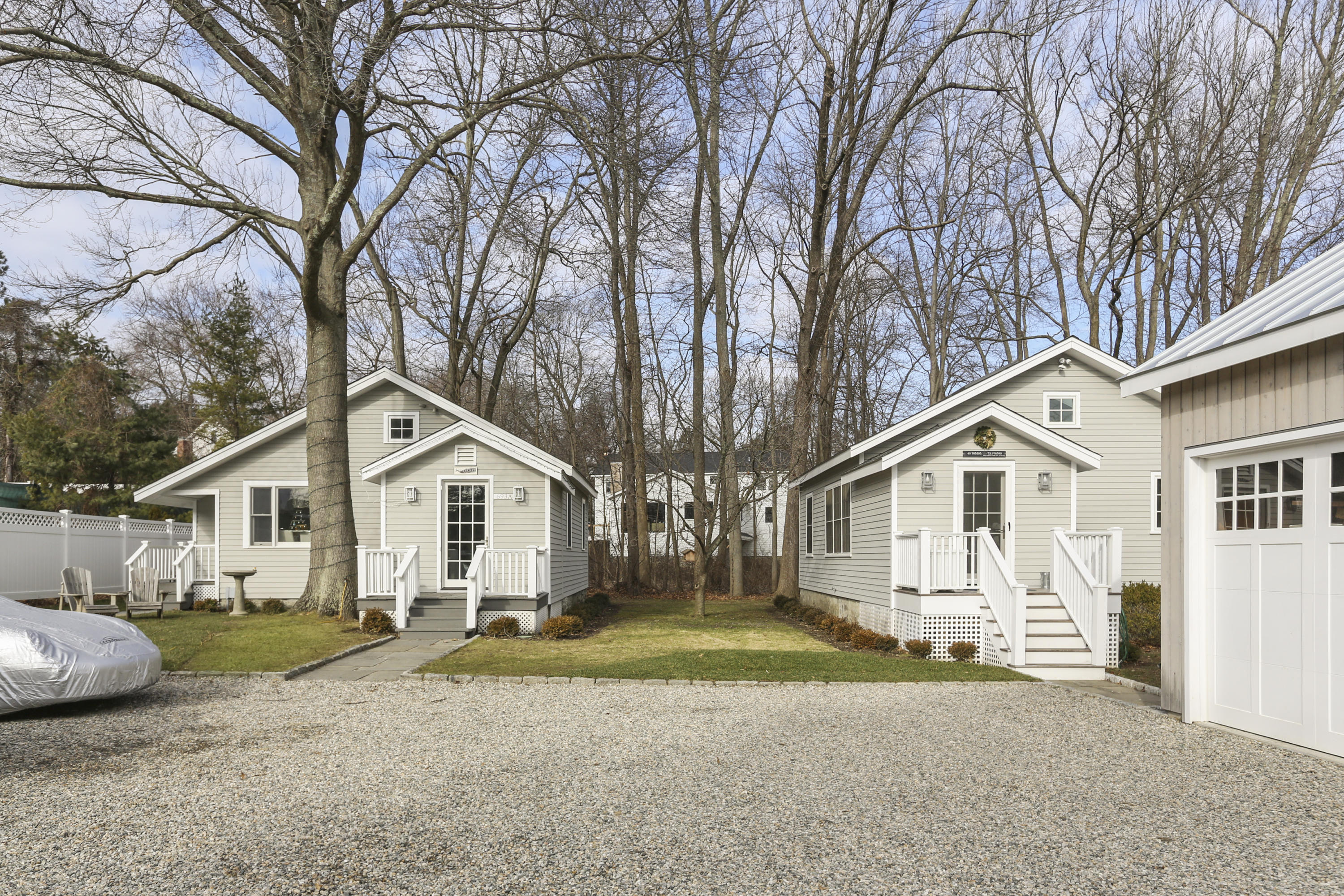 693 Post Road Darien, CT 06820 - Photo 25 of 41 a view of a yard in front of a house with large trees