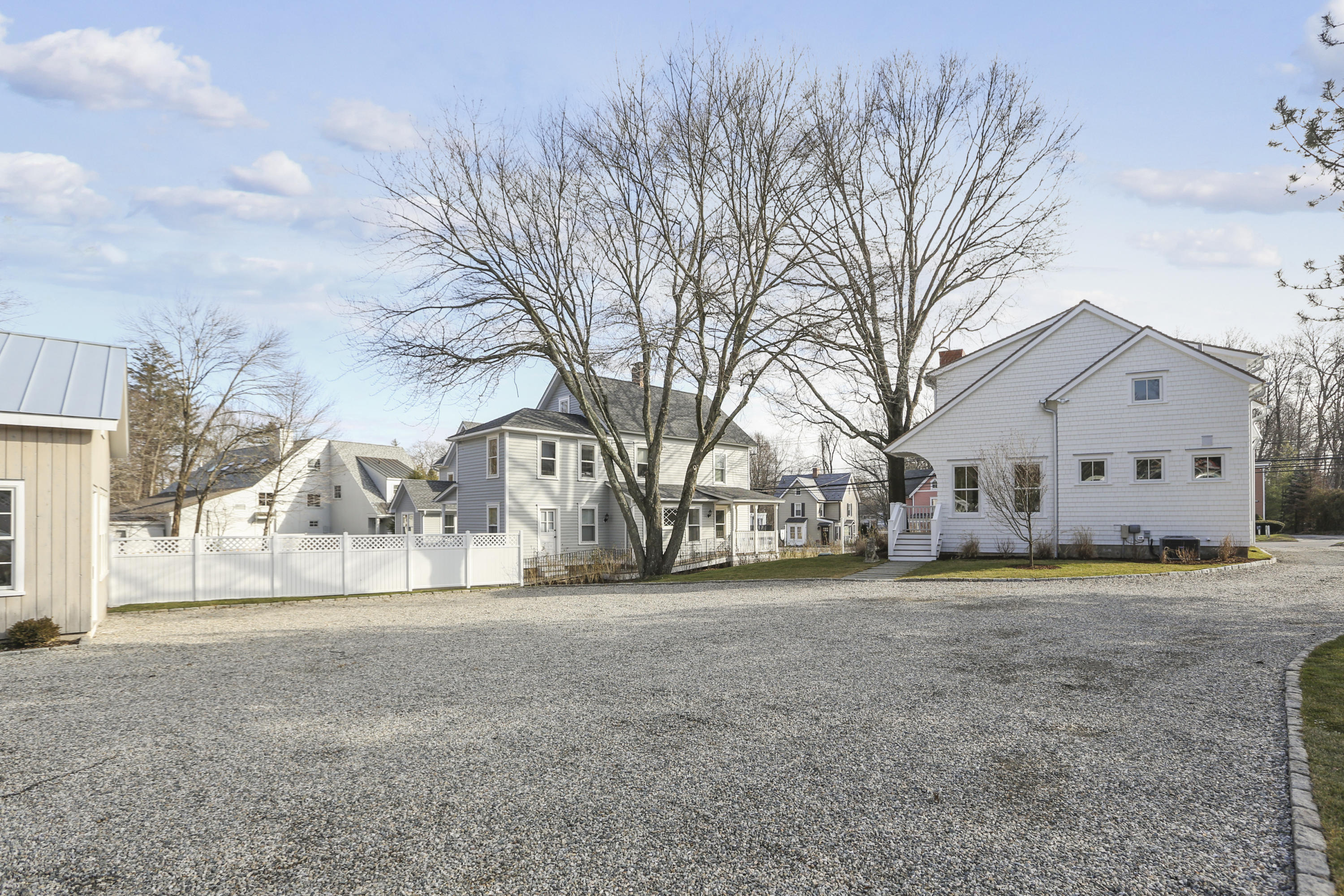 693 Post Road Darien, CT 06820 - Photo 27 of 41 a view of a house with a yard covered in snow