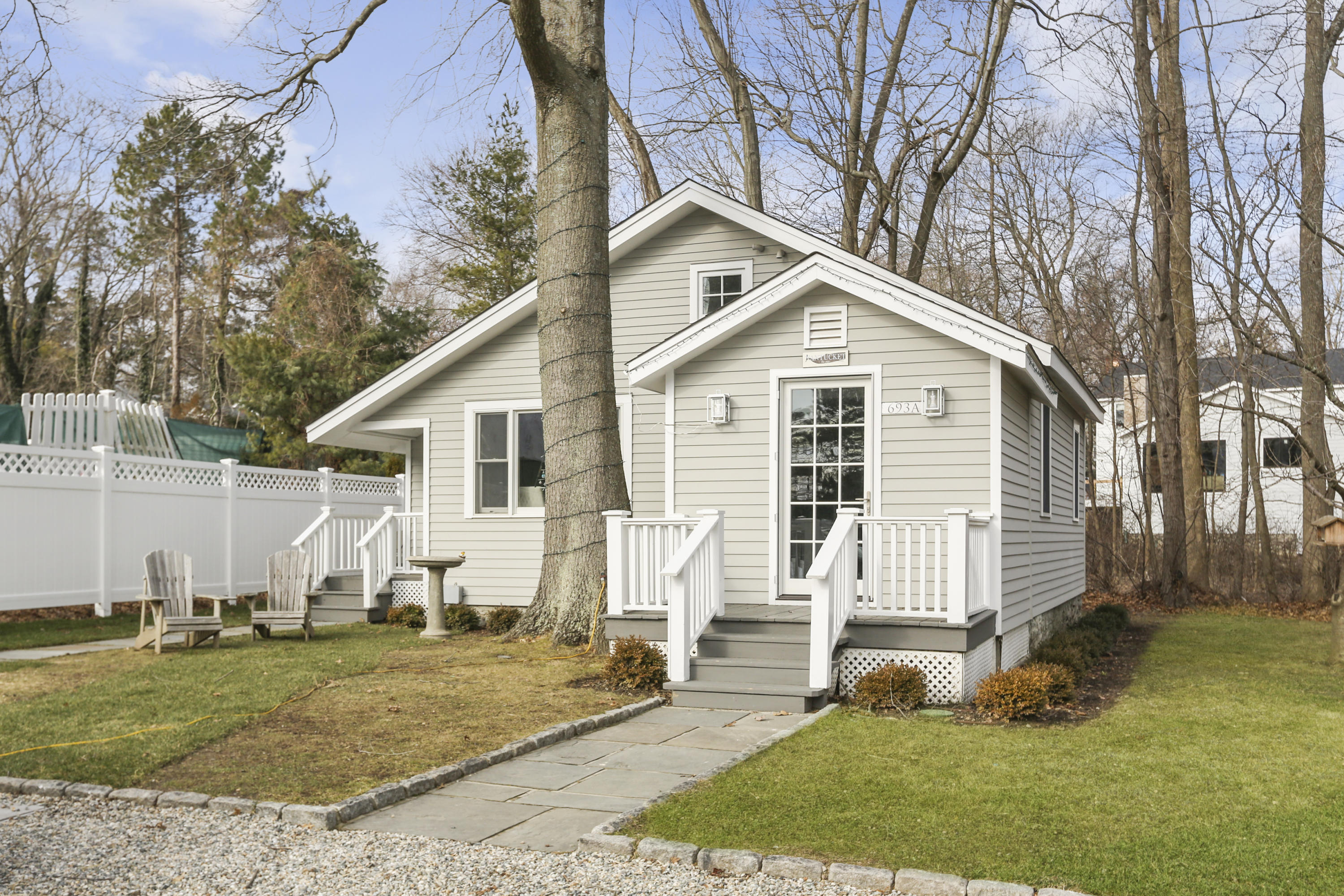 693 Post Road Darien, CT 06820 - Photo 28 of 41 a view of a house with a yard patio and fire pit