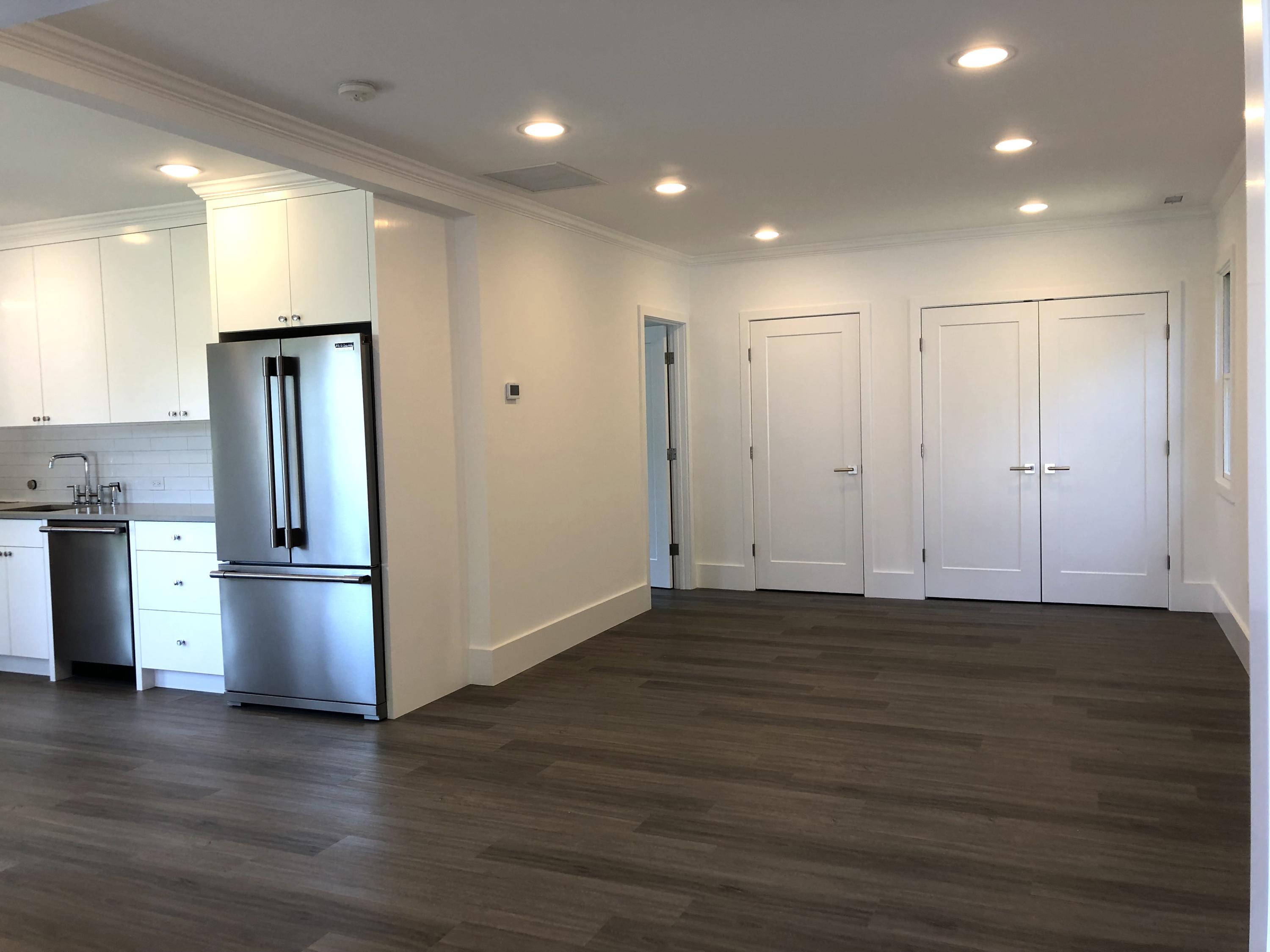 693 Post Road Darien, CT 06820 - Photo 30 of 41 an empty room with wooden floor and entrance