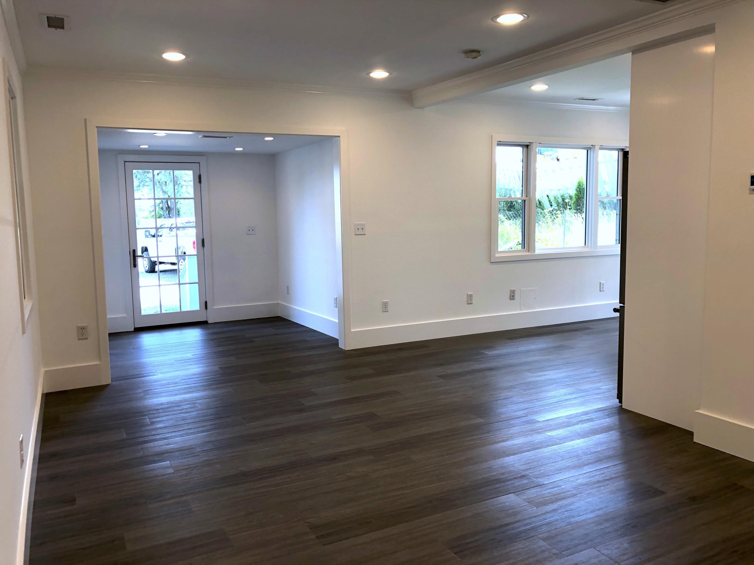 693 Post Road Darien, CT 06820 - Photo 31 of 41 an empty room with wooden floor and windows