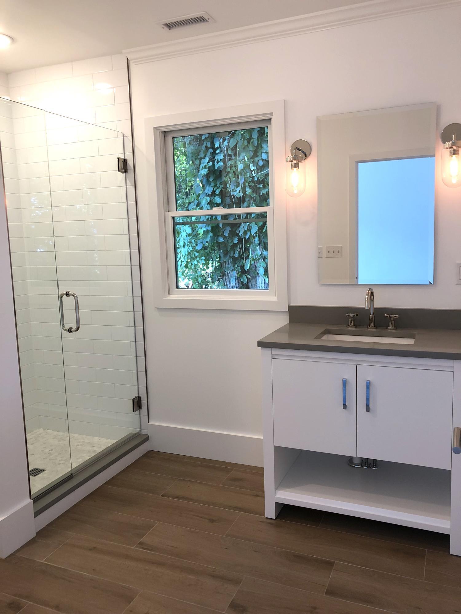693 Post Road Darien, CT 06820 - Photo 32 of 41 a bathroom with a sink and a mirror