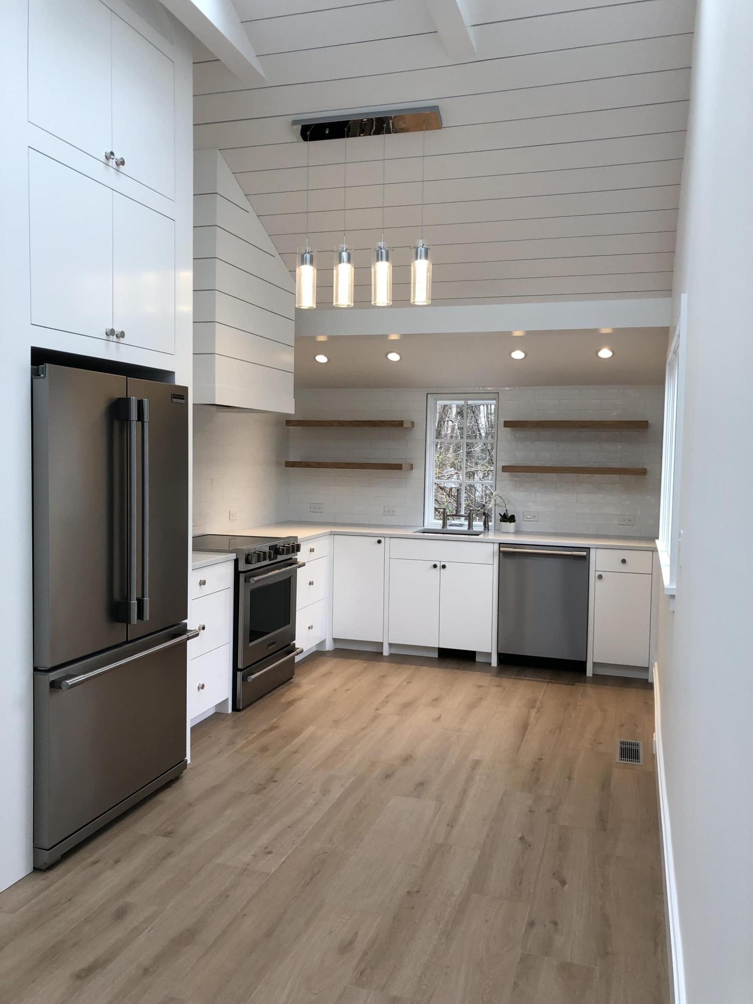 693 Post Road Darien, CT 06820 - Photo 34 of 41 a kitchen with stainless steel appliances a sink cabinets and wooden floor