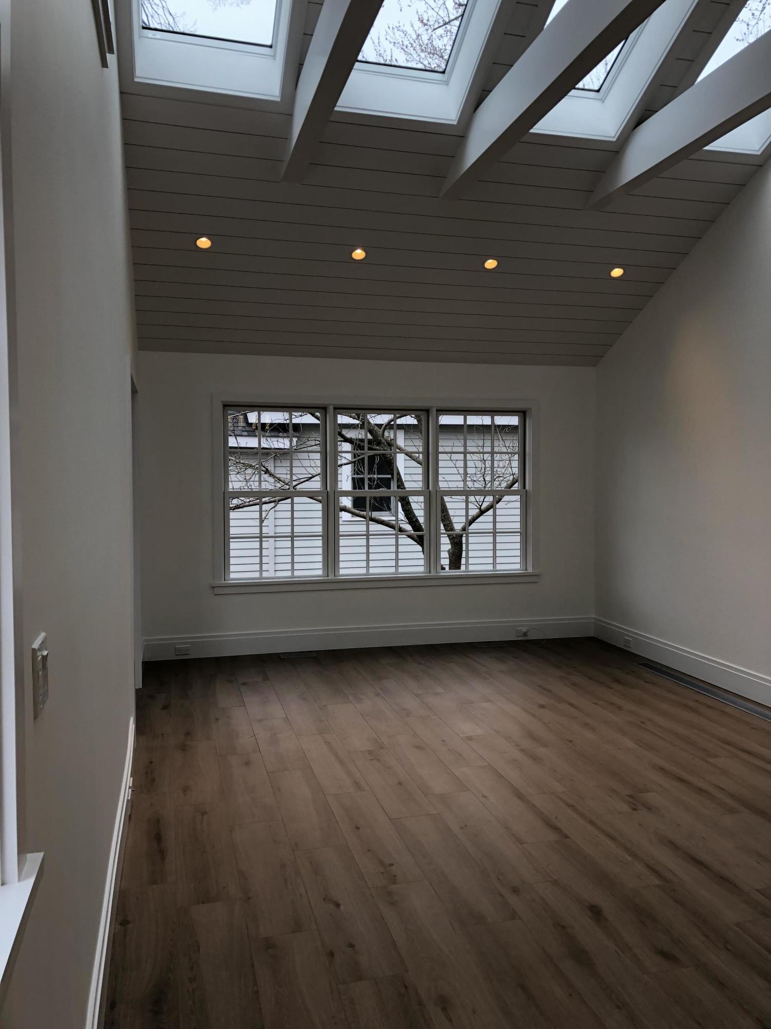 693 Post Road Darien, CT 06820 - Photo 36 of 41 a view of an empty room with wooden floor and a window