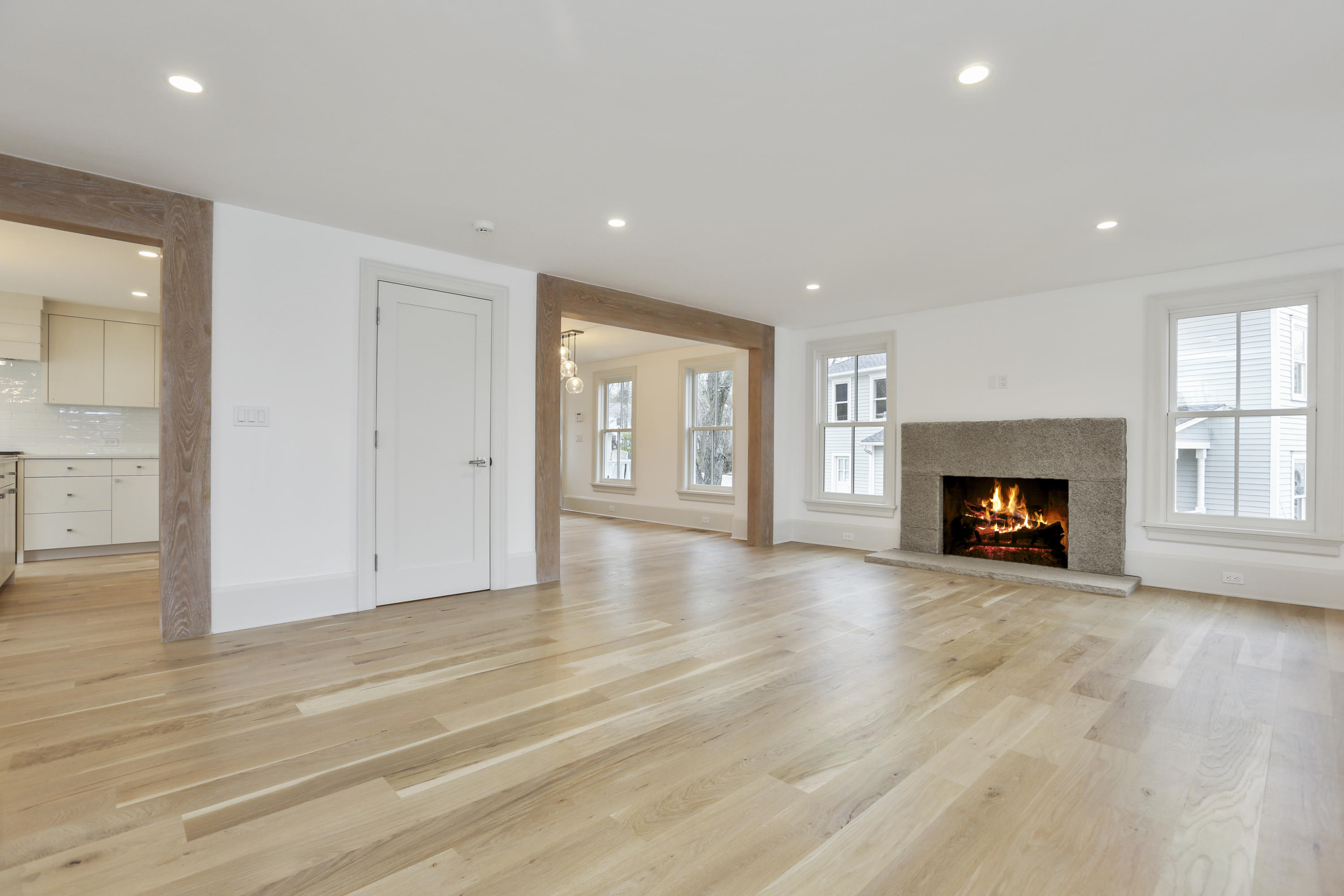 693 Post Road Darien, CT 06820 - Photo 5 of 41 a view of an empty room with a fireplace and a window
