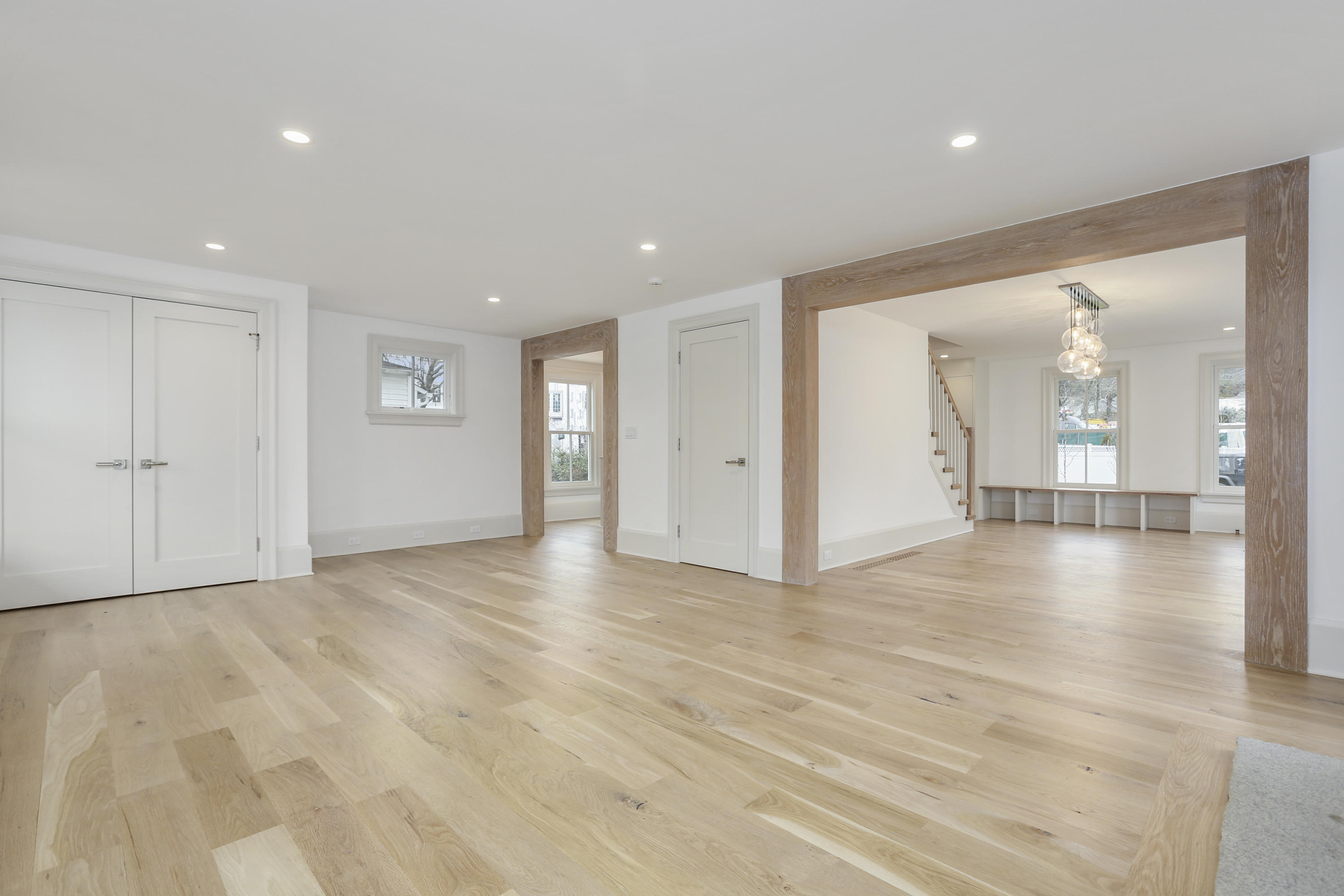 693 Post Road Darien, CT 06820 - Photo 6 of 41 a view of an empty room with wooden floor and windows