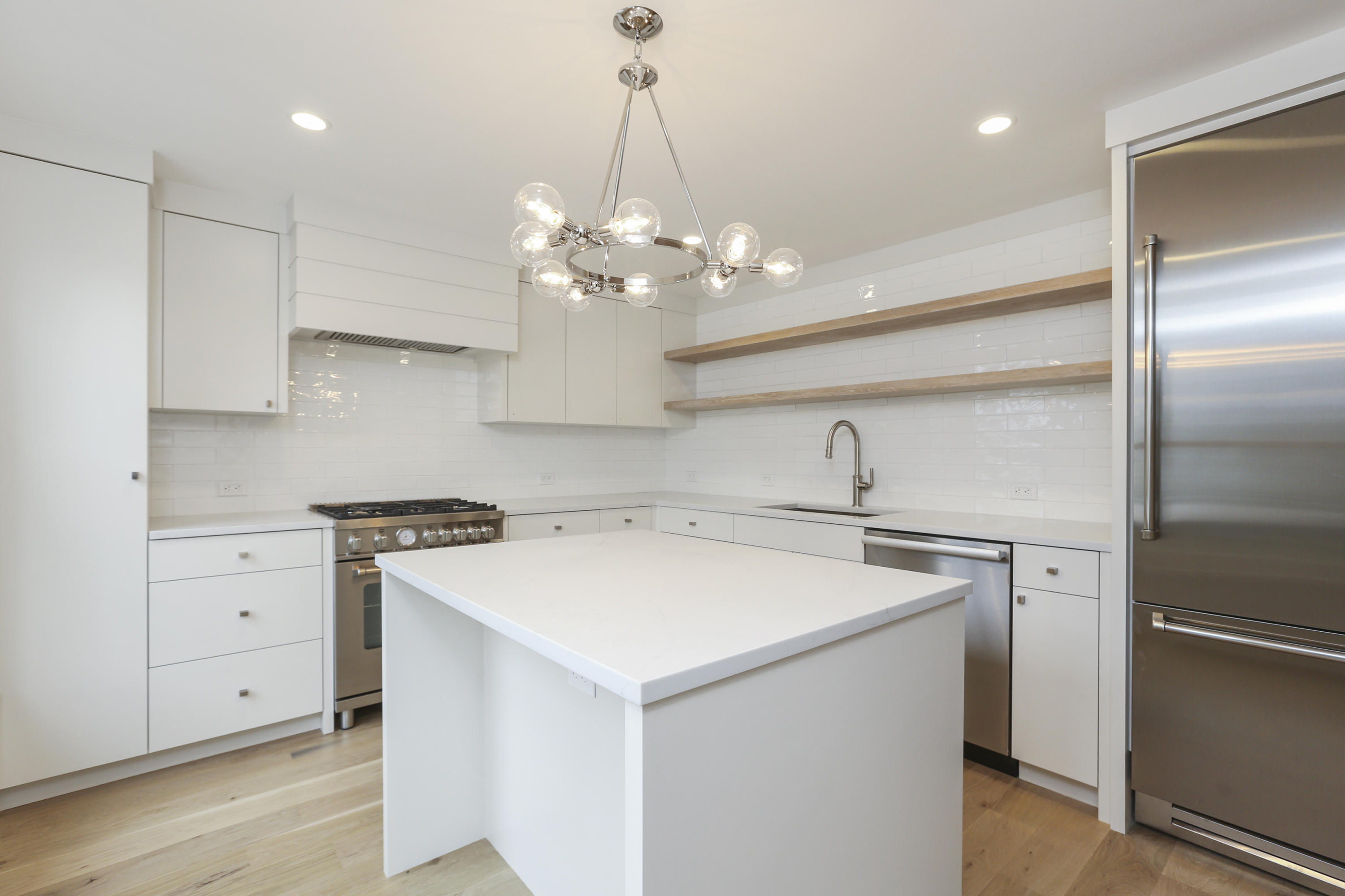 693 Post Road Darien, CT 06820 - Photo 9 of 41 a kitchen with a sink a stove and refrigerator