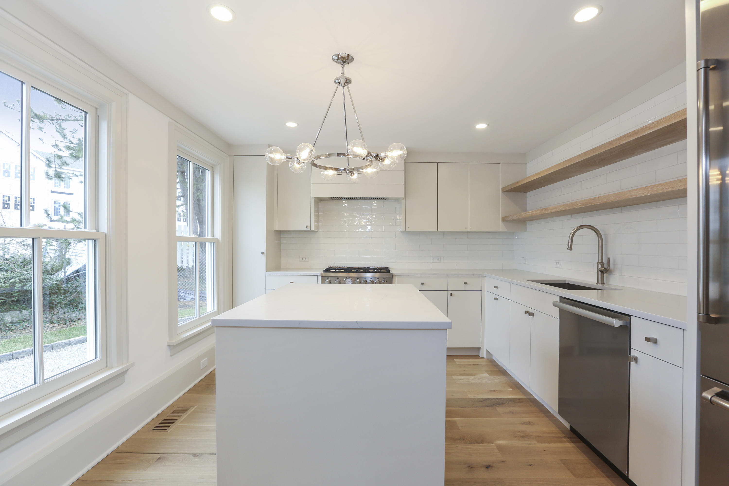 693 Post Road Darien, CT 06820 - Photo 10 of 41 a kitchen with kitchen island a sink stainless steel appliances and cabinets