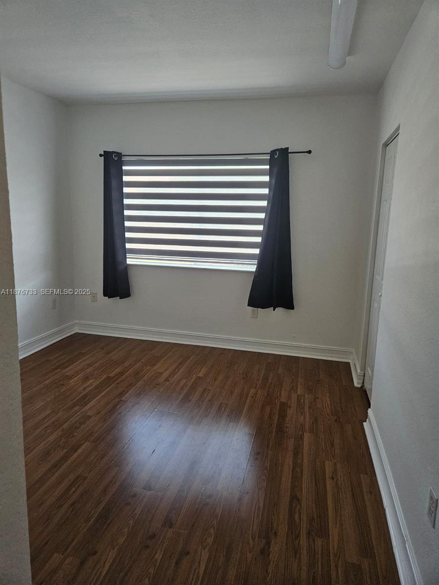 7995 Northwest 8th Street, Unit 103 Miami, FL 33126 - Photo 17 of 17 wooden floor in an empty room