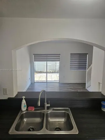 a kitchen with a sink and a window
