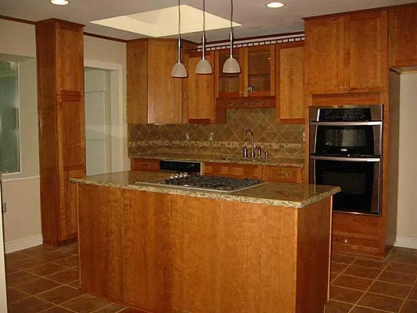 a kitchen with stainless steel appliances a refrigerator and a stove