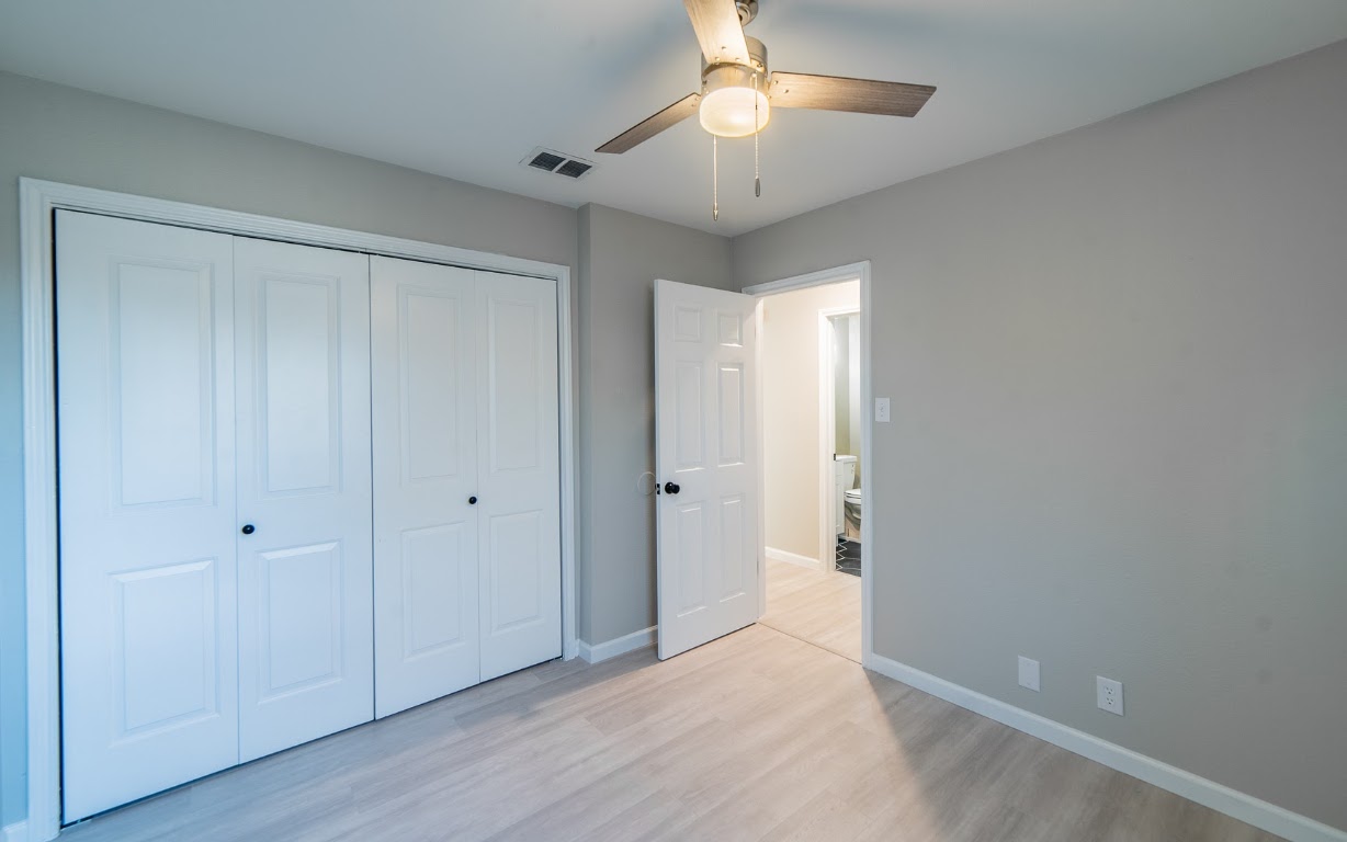 916 Sirocco Drive, Unit B Austin, TX 78745 - Photo 16 of 18 a view of an empty room and chandelier fan