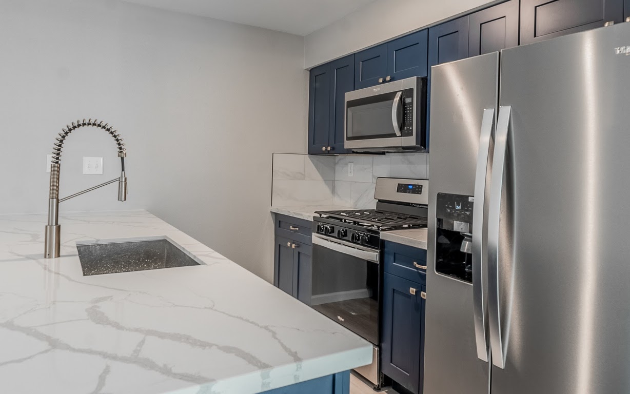 916 Sirocco Drive, Unit B Austin, TX 78745 - Photo 5 of 18 a kitchen with a refrigerator stove and microwave