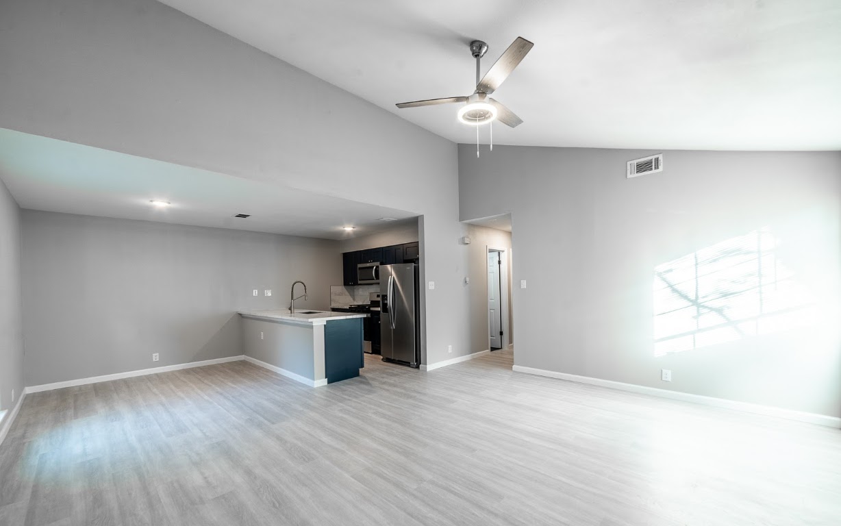 916 Sirocco Drive, Unit B Austin, TX 78745 - Photo 9 of 18 a view of a kitchen with a sink and a refrigerator