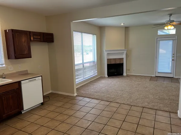 a view of a kitchen with furniture and a fireplace