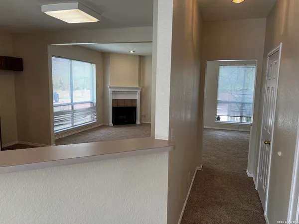 a view of livingroom with an empty space and window