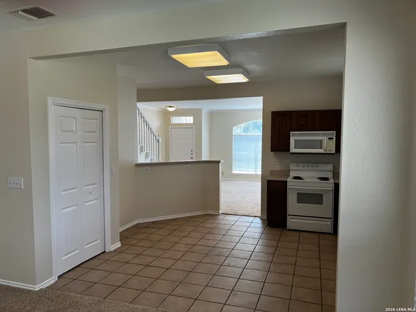 a view of a kitchen with a sink