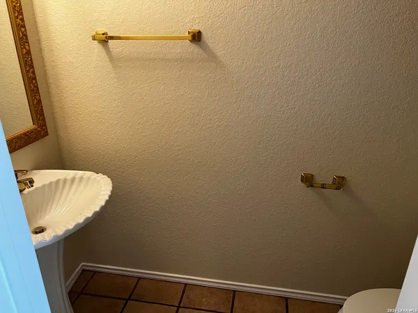 a bathroom with a sink and toilet