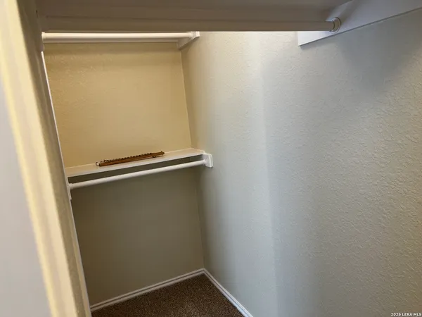 a view of empty room with a bathroom
