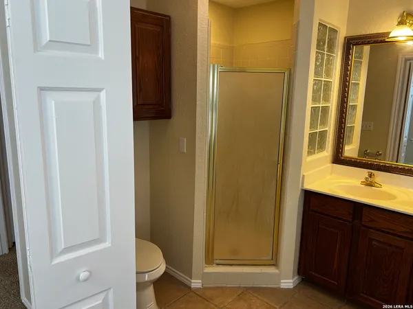 a view of a room with a empty space and empty shelves