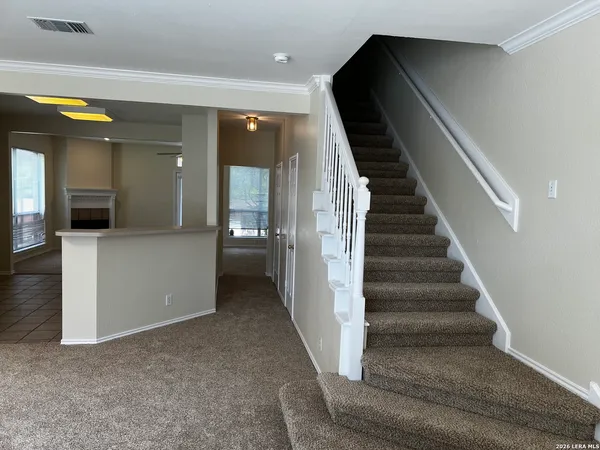 a view of a hallway view with staircase