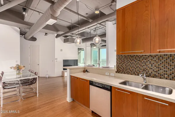 a kitchen with a sink and cabinets