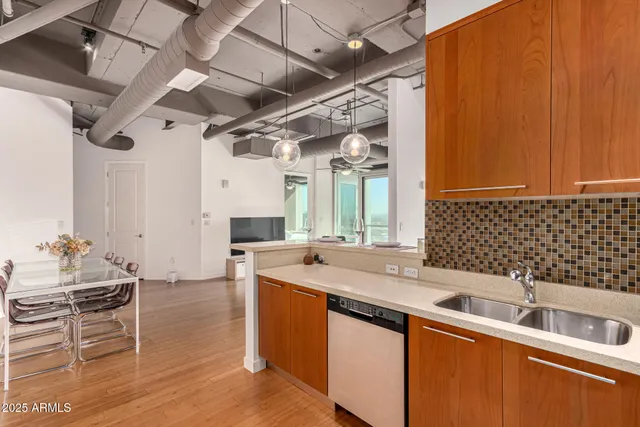 a kitchen with a sink and cabinets