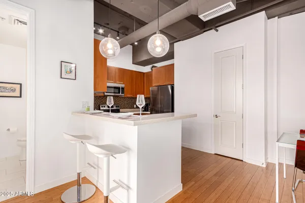 a kitchen with a table and chairs