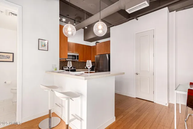 a kitchen with a table and chairs
