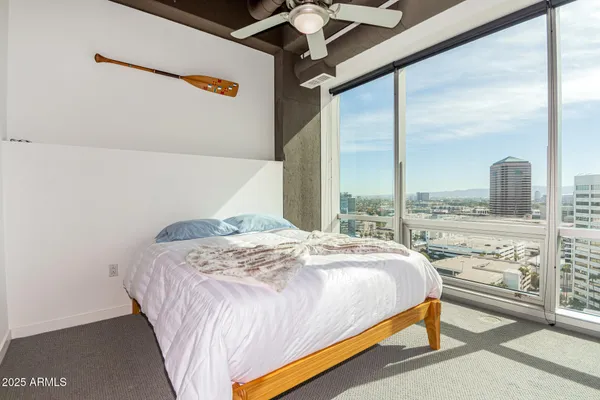 a bedroom with a bed and window