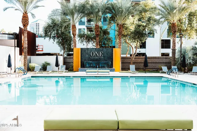 a view of swimming pool with outdoor seating