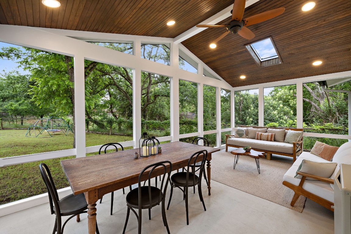 gorgeous screened-in porch with vaulted wooden ceiling & dimmable recessed lighting. Its perfect for meals and entertaining, watching hummingbirds and enjoying the verdant green backyard.