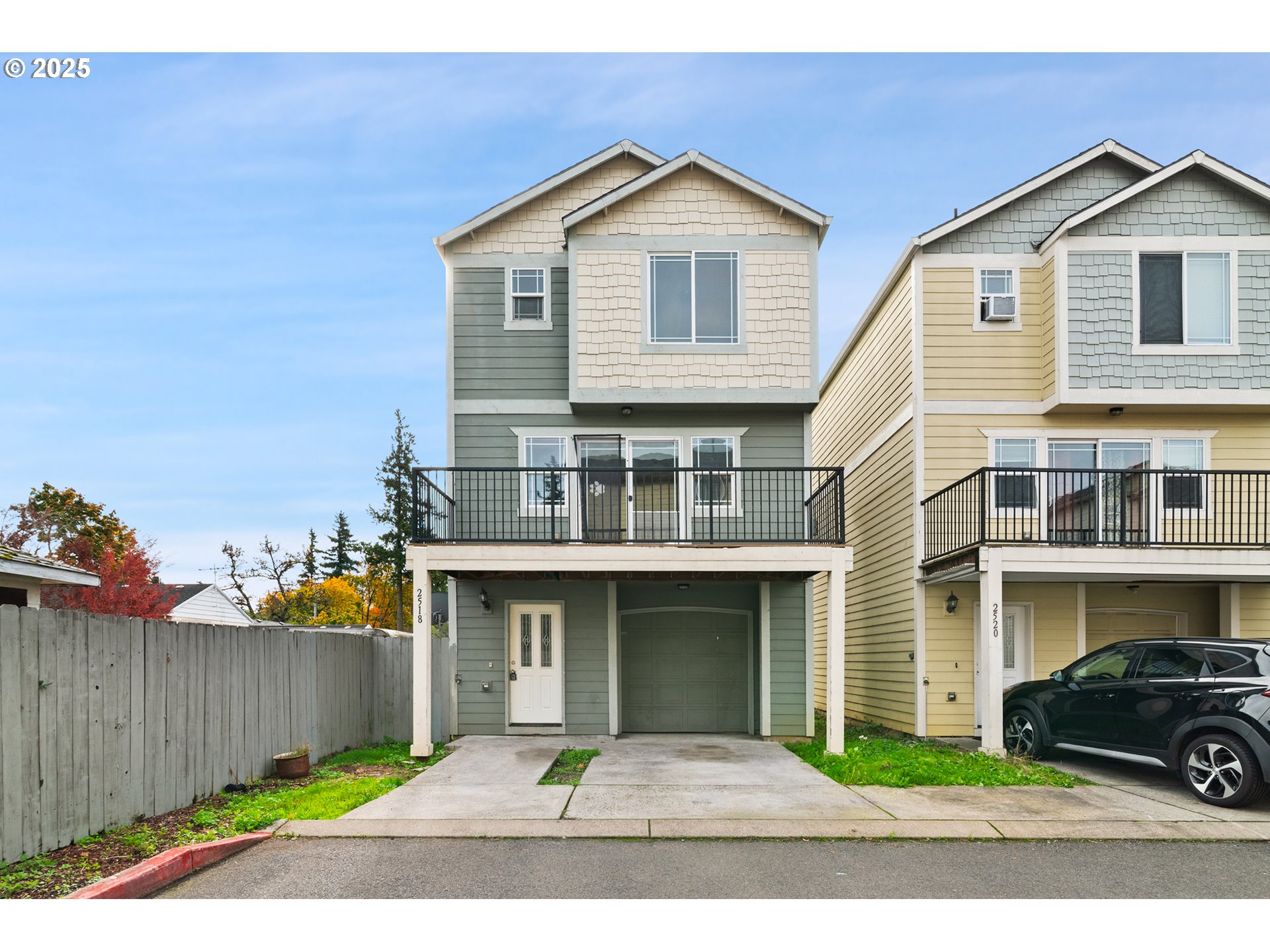 2518 Southeast 130th Avenue, Unit 5 Portland, OR 97236 - Photo 1 of 13 a front view of a house with a yard and garage