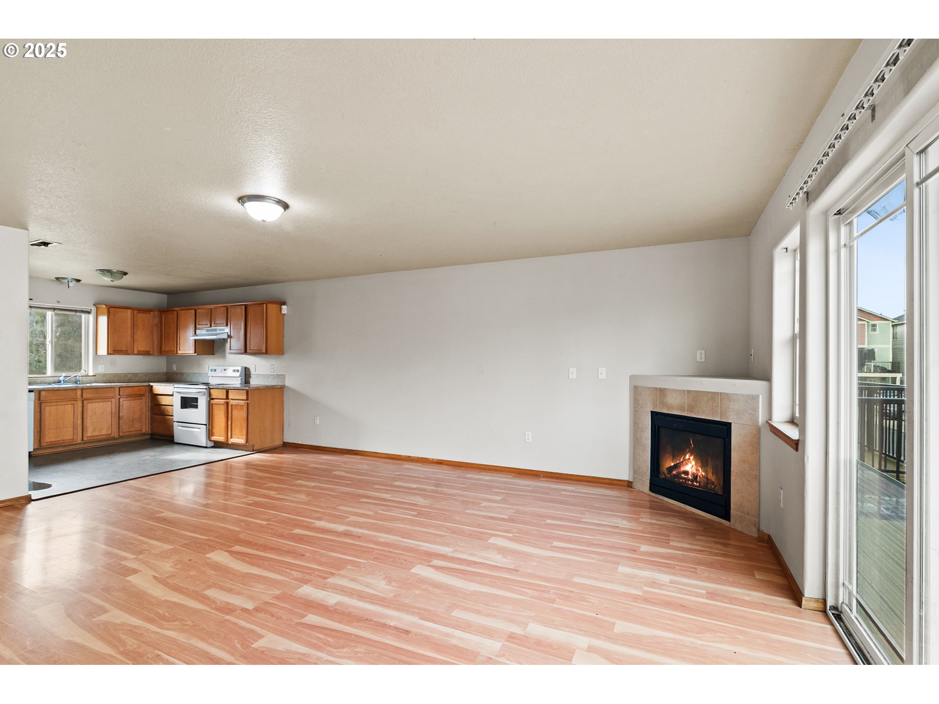 2518 Southeast 130th Avenue, Unit 5 Portland, OR 97236 - Photo 7 of 13 a view of a livingroom with furniture and a fireplace