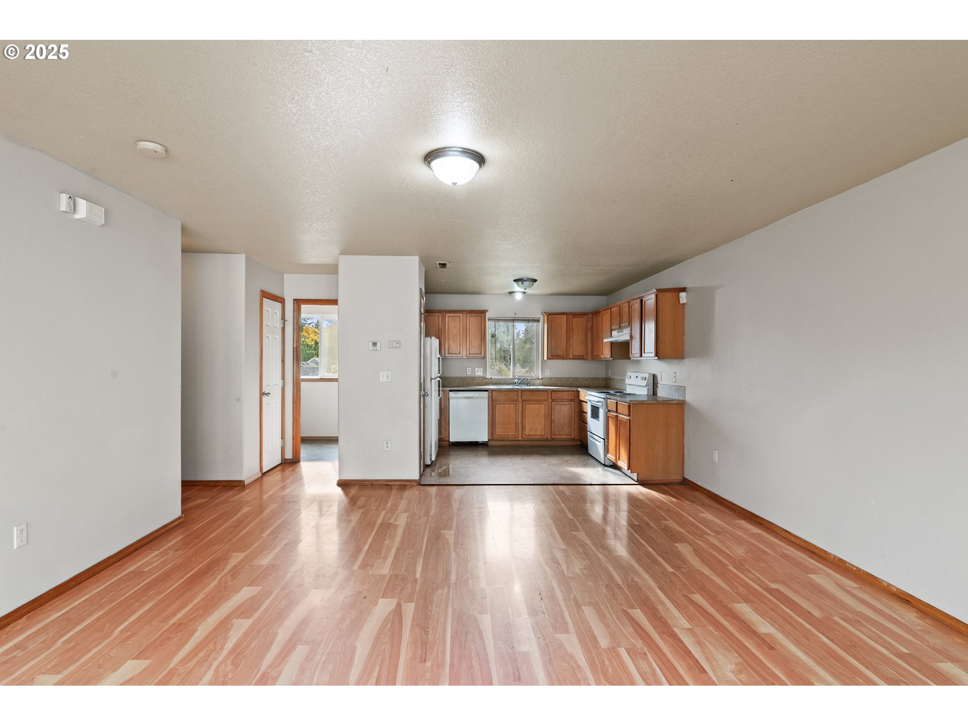 2518 Southeast 130th Avenue, Unit 5 Portland, OR 97236 - Photo 8 of 13 a view of a kitchen with wooden floor